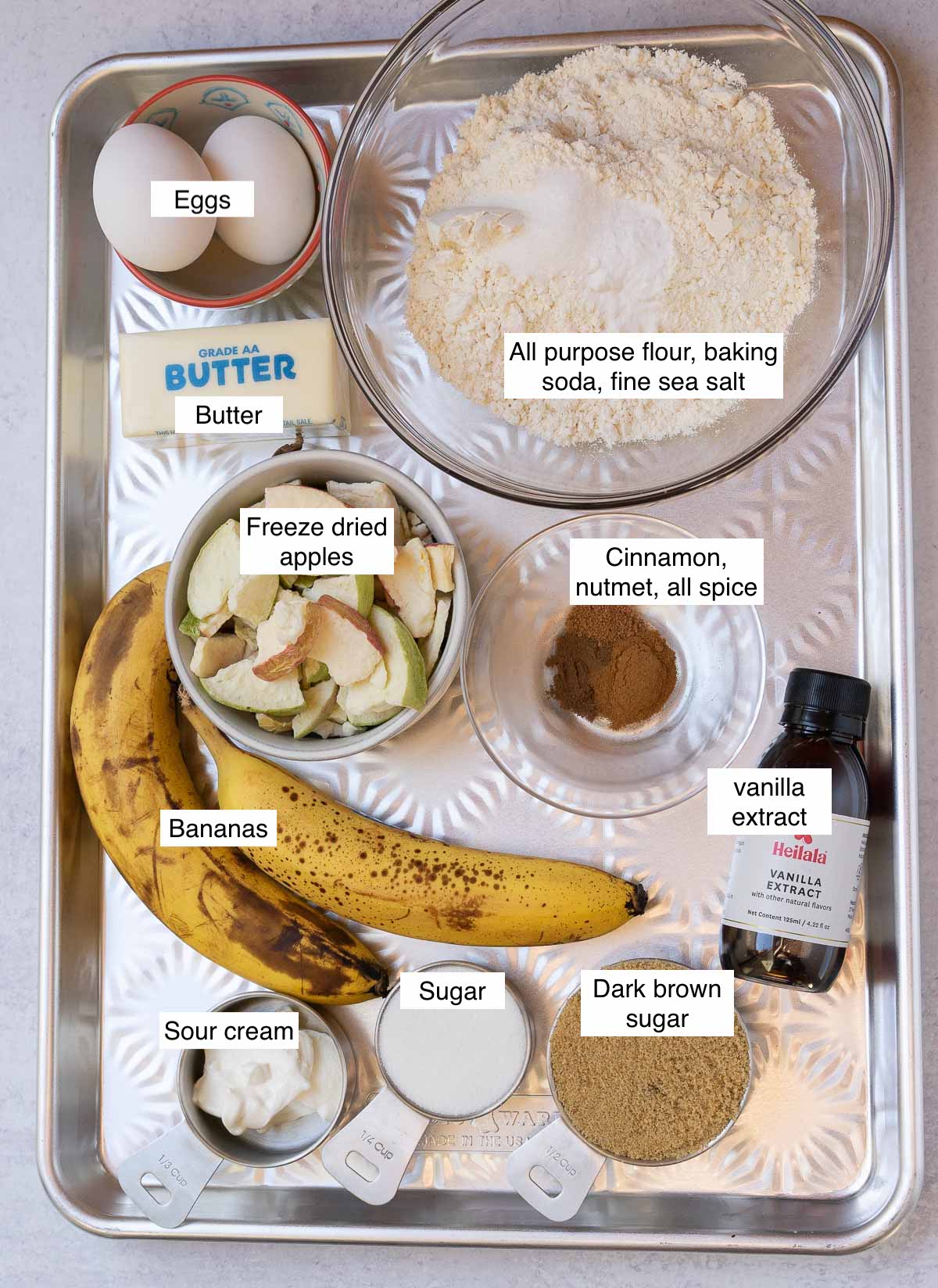 ingredients displayed and identified for banana apple bread.