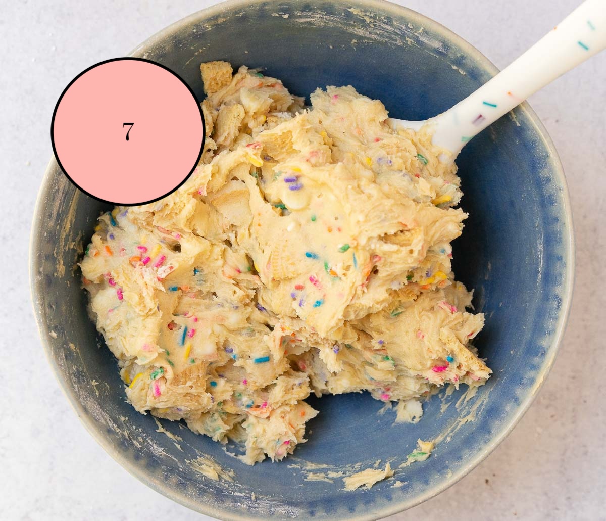 soft sprinkle cookies mixed with spatula.