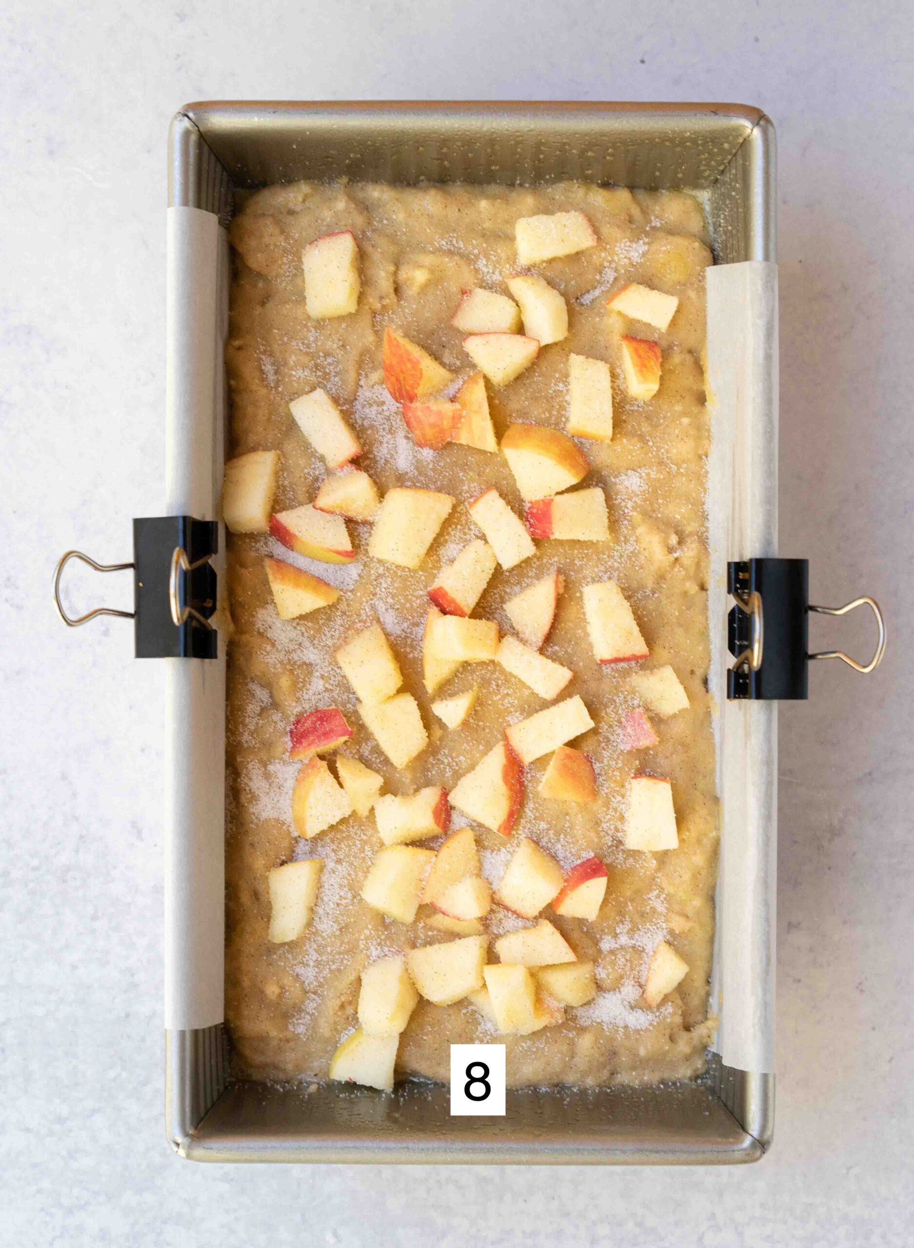 adding diced apples on top of batter.