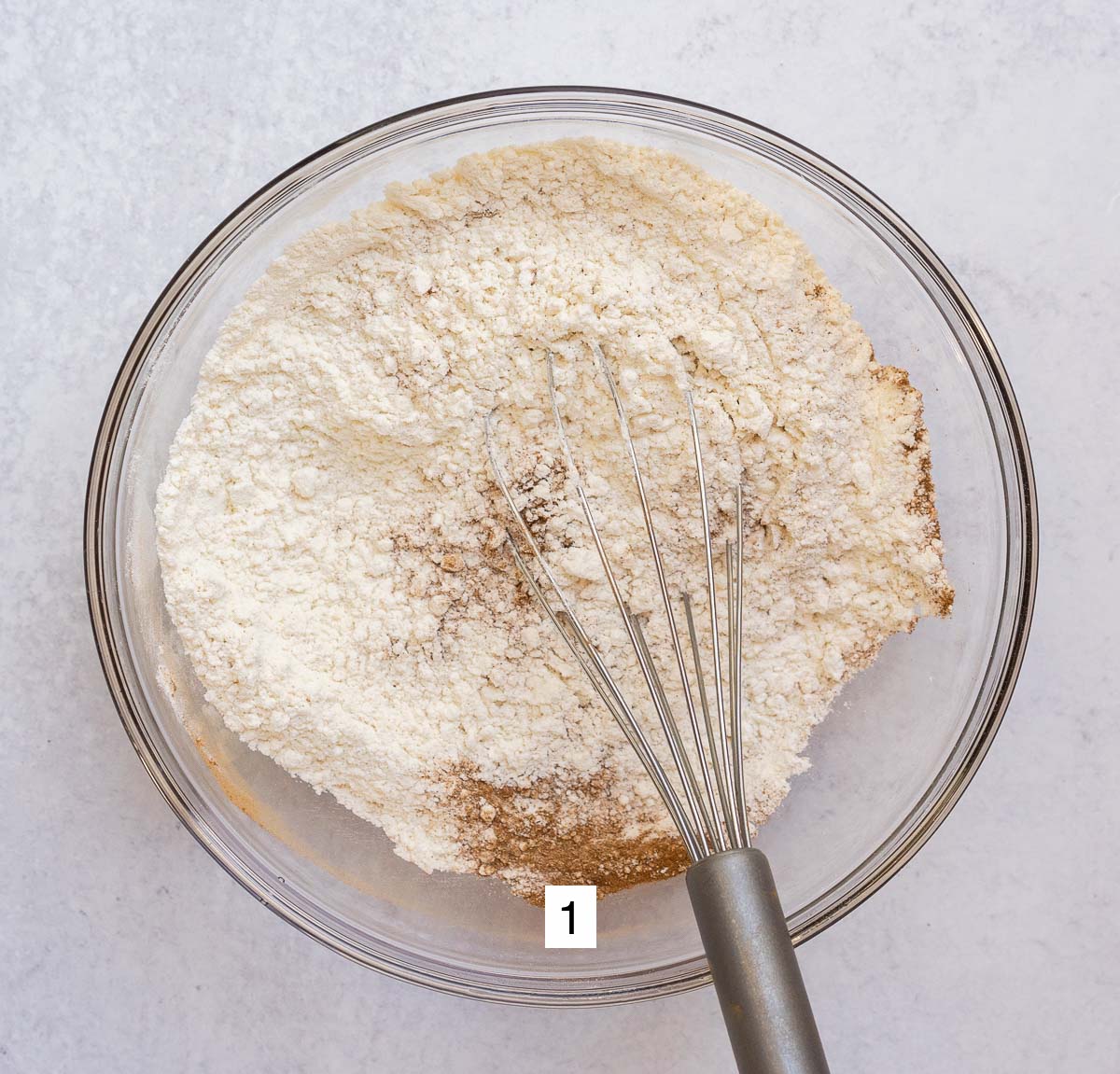 sifting dry ingredients in bowl.