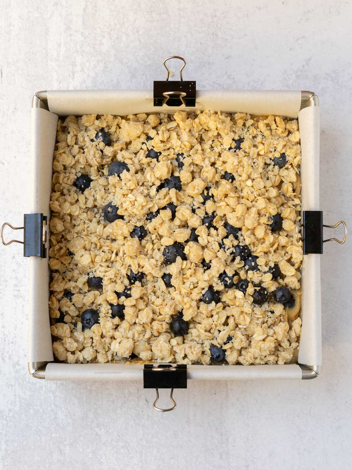 crumble topping added to blueberry blondies before baking.