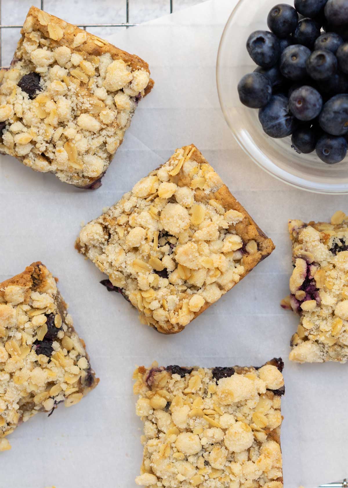 blueberry blondies cut up on wire rack.