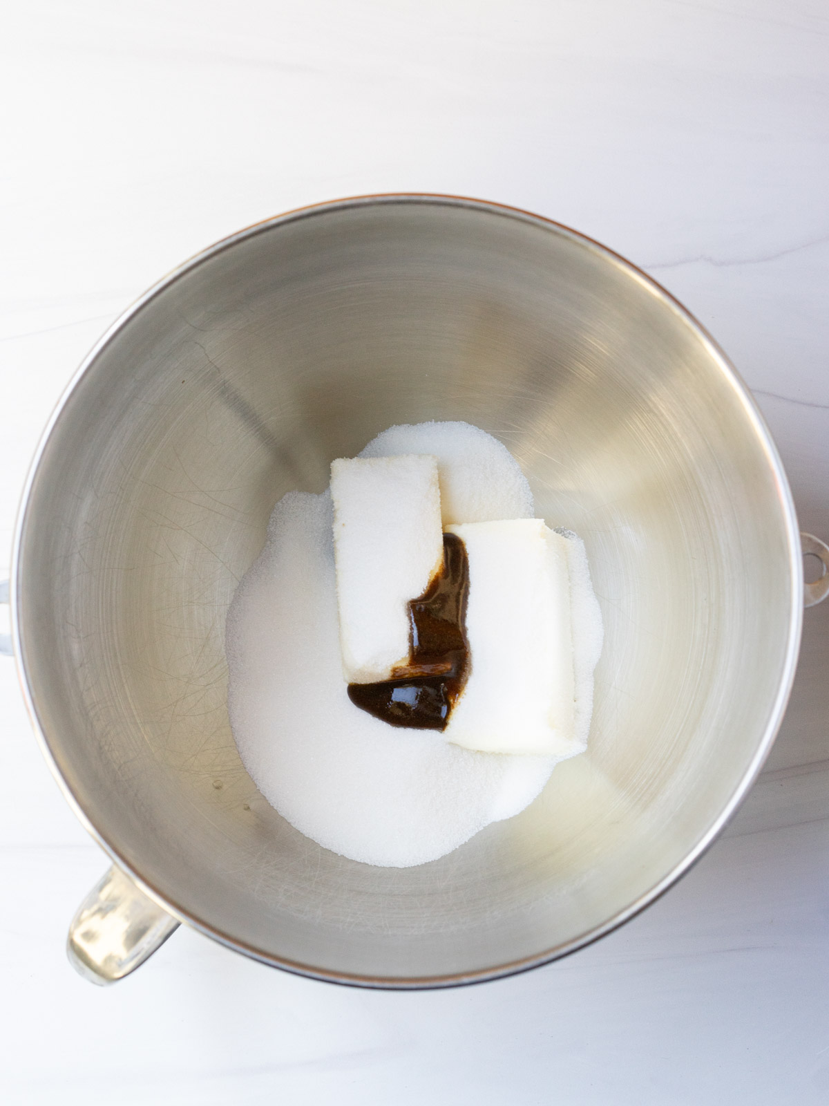 sugar, butter and vanilla bean paste in mixing bowl.