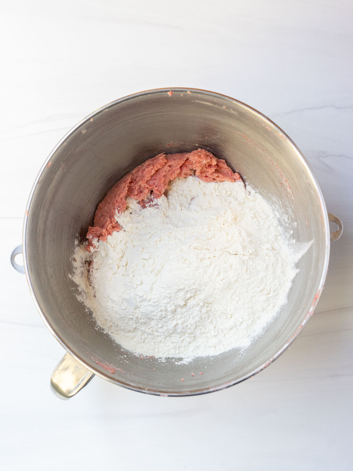 dry ingredients added to wet ingredients in mixing bowl.