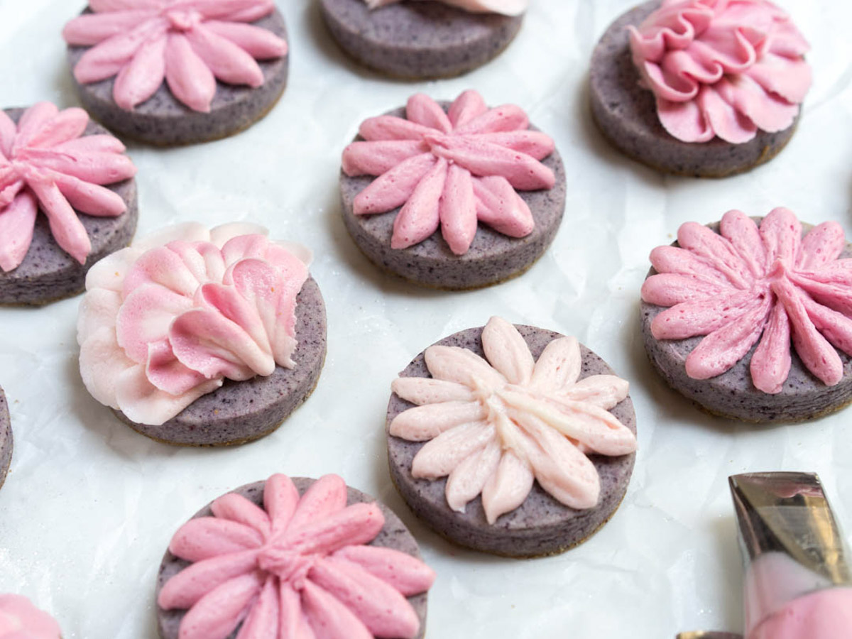 blueberry lemon sugar cookies decorated with buttercream frosting.