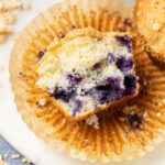 blueberry muffin in half displaying inside.