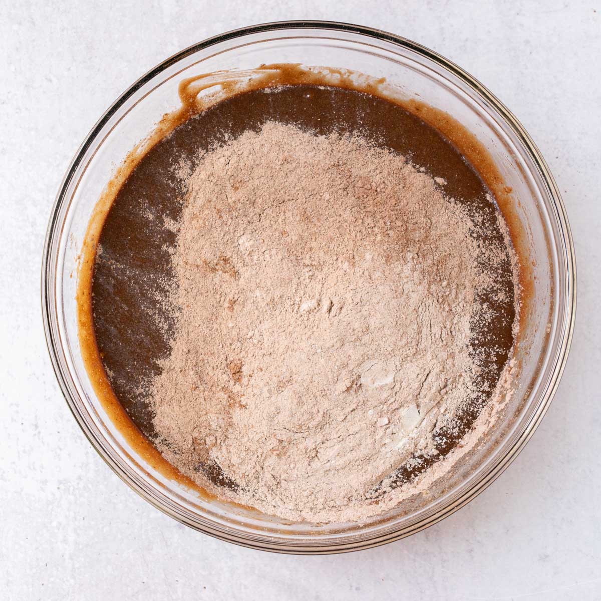 dry ingredients added to wet ingredients for Mexican Hot Chocolate Brownies.