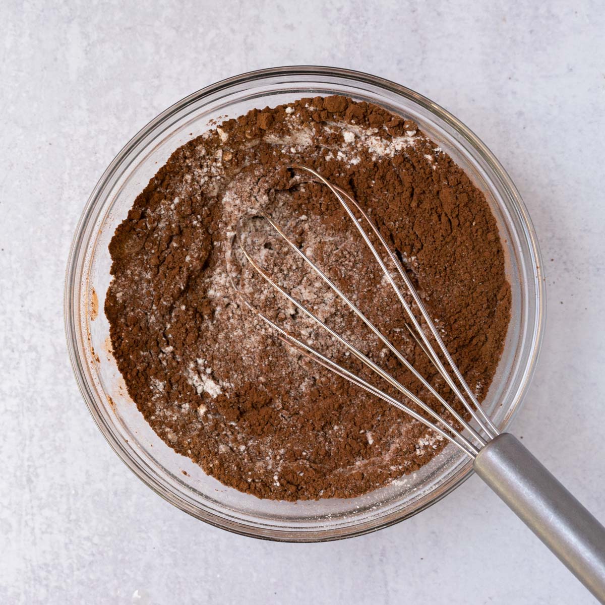 whisking cocoa powder and flour.