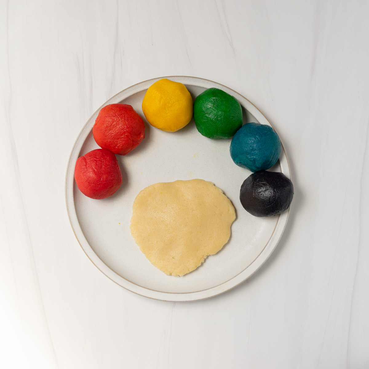 rainbow cookie dough on bowl.