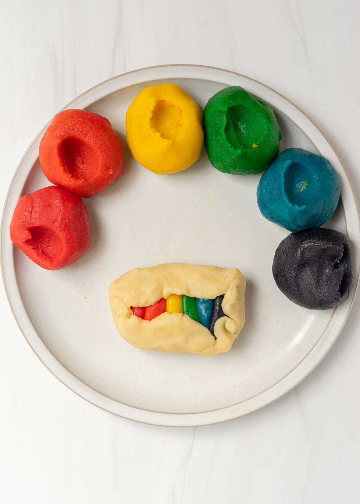 rainbow butter cookie dough on plate.