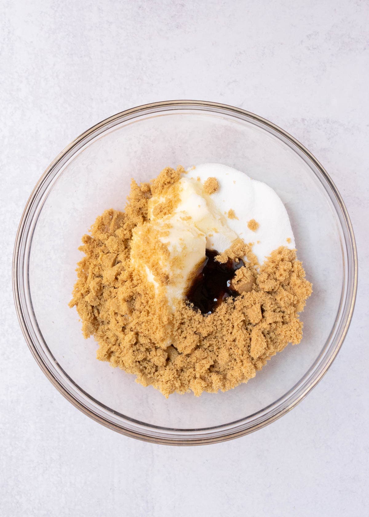 butter, vanilla and sugar in mixing bowl.