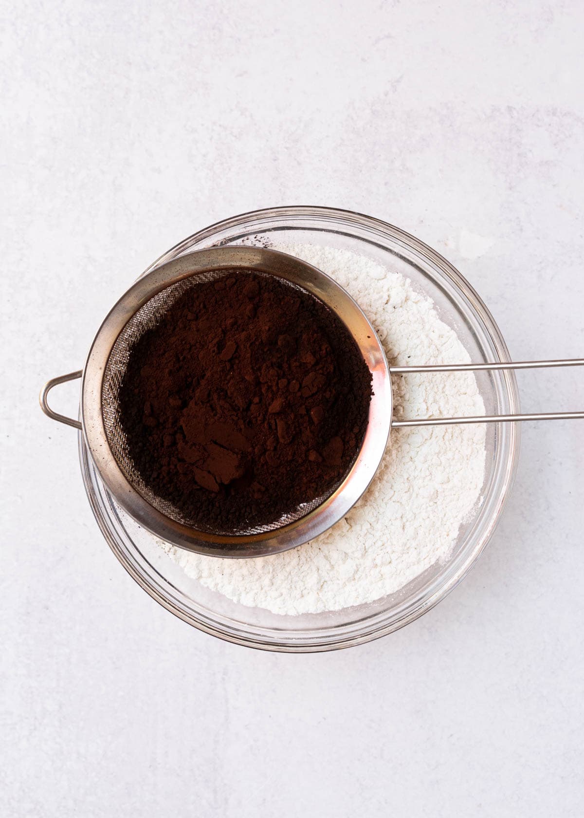 sifting black cocoa and flour.