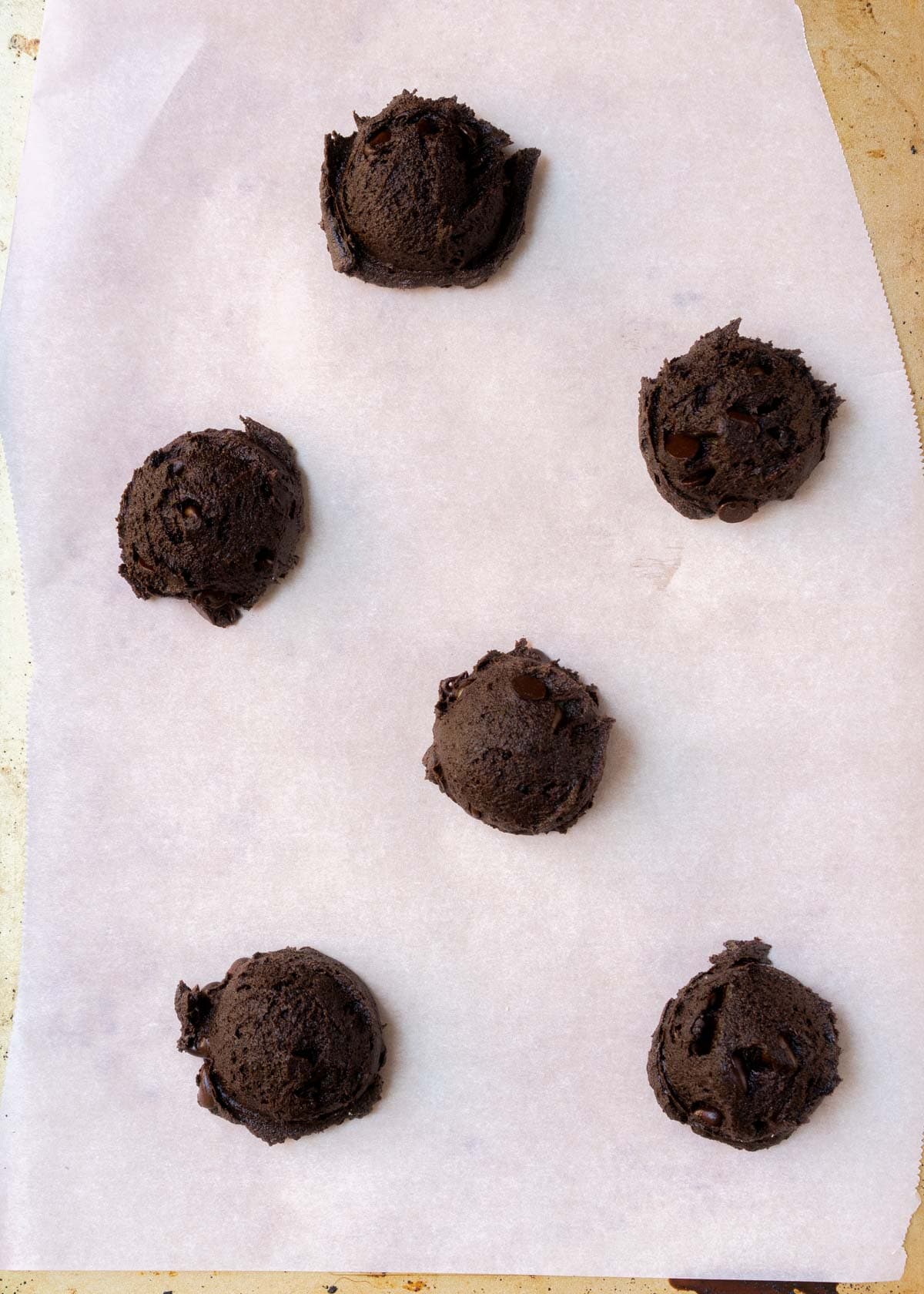 black cocoa dough on baking sheet.
